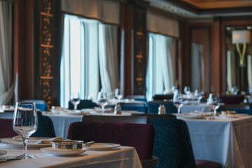 Formal and elegant ocean view dining room restaurant onboard luxury cruiseship or cruise ship liner...