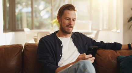 Fototapeta na wymiar Reading, sofa and man with phone in home for social media, online networking and chat on mobile app. Relax, news and person on smartphone for internet, contact and message notification on weekend
