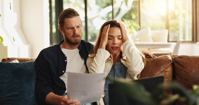 Stress, finance and couple on laptop with paperwork for bills, mortgage payment and online banking. Home, marriage and man with upset woman on computer for digital taxes, loans and financial crisis