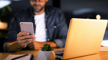 Hands, night and man in office, cellphone and message to contact, social media and communication....