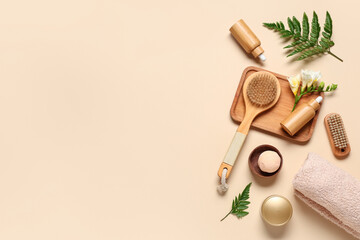 Composition with spa accessories, cosmetics and fern leaves on color background