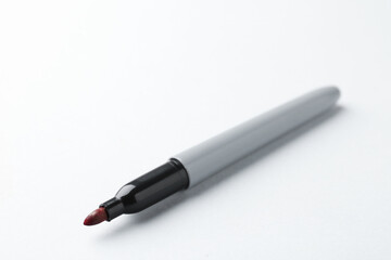One red marker on light background, closeup. Space for text