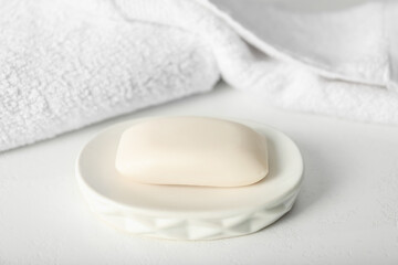 One soap bar on white table, closeup