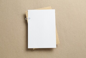 Blank invitation card and envelope on carton, top view. Space for design