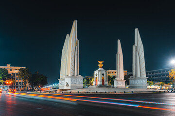 Thailand night life with scenery motion blur traffic in Bangkok at Democracy Monument near popular...