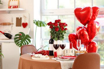 Festive table setting in light dining room decorated for Valentine's Day