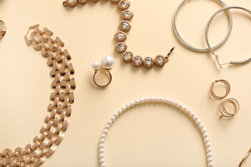 Different beautiful jewelry on yellow background