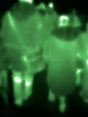 Street traffic. Pedestrians, rush hour. Image thermal imager device Medium infrared spectrum.