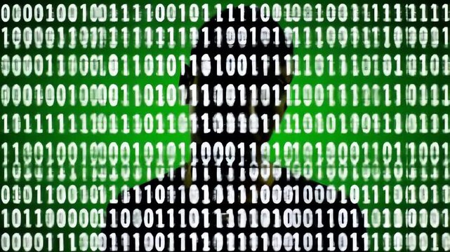 Anonymous Hacker Silhouette Against Binary Code Background