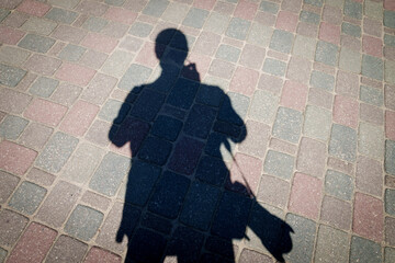 Selective focus photo. Silhouette of photographer.