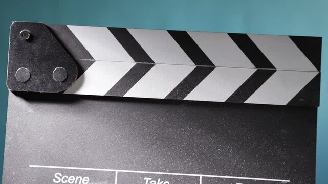 Movie scene setup, action board clapping, creating a cinematic effect with flying chalk dust