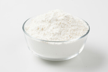 Flour is a powder made by grinding wheat.

