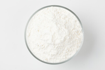 Flour is a powder made by grinding wheat.
