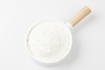 Flour is a powder made by grinding wheat.
