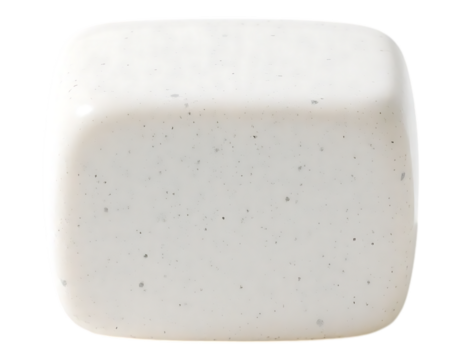 Close-up of a smooth, white cube with rounded edges