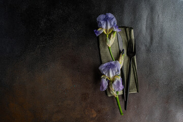 Table setting with pale blue iris flowers