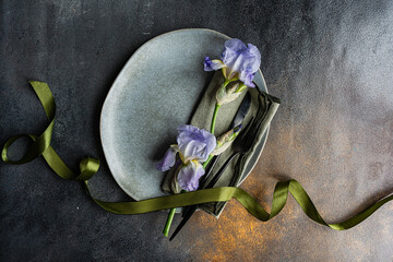 Table setting with pale blue iris flowers