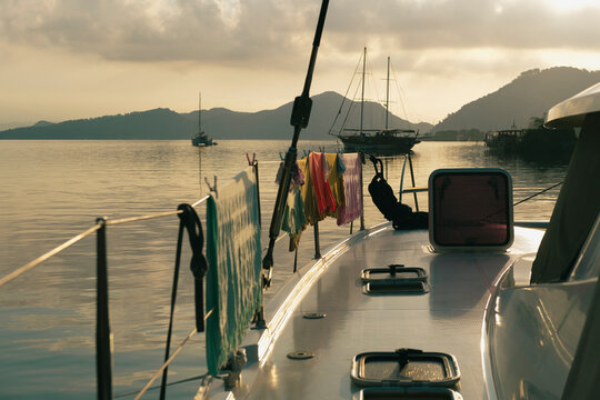 laundry day at sailing boat catamaran, anchor scenic view, cloudy morning sky