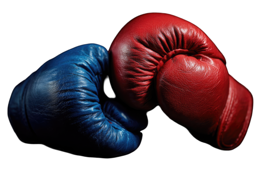 Two boxing gloves, red and blue, meet in the center.  Leather, worn,  close-up, against black background