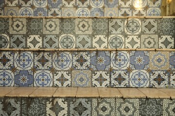 Stairs decorated with beautiful tiles indoors, closeup