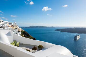 Fototapeta premium White architecture in Santorini island, Greece. Beautiful terrace with sea view at sunny day.