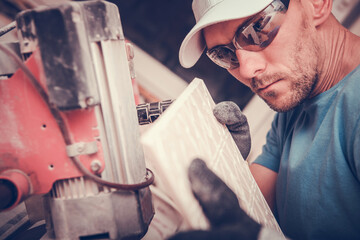 Skilled Worker Cutting Tiles With Precision in a Construction Setting
