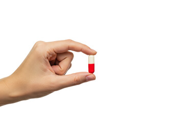 Isolated Hand Holding a Red and White Capsule Pill