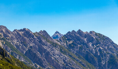 Obraz premium Alpine mountain rocks hills landscape panorama blue sky Tyrol Austria.