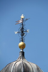 An Ornamental Wind Vane on a Bright Sunny Day.