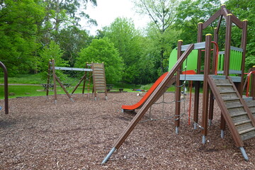 Fototapeta premium Children playground equipment stands ready for fun and games in park