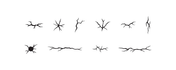 Set of isolated black crack patterns on white background.