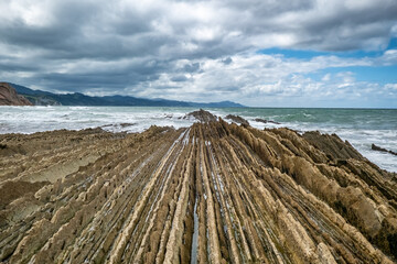 Beautiful rock formations of the Itzurun beach, Zumaia town, Basque country, Spain