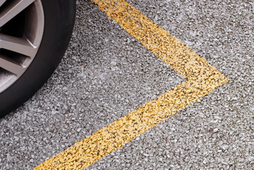 wheel of a car on parking spot