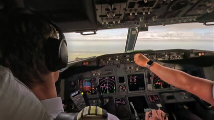 Airline pilot in commercial aircraft cockpit during flight - Powered by Adobe