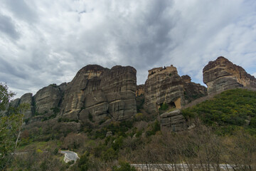 Scenic view of landscape of the famous and majestic rock formations of Meteora with Varlaam Monastery under a cloudy sky, Kalambaka, Thessaly, Greece