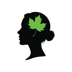 Thoughtful Leaf: A silhouette of a woman's head, a vivid green maple leaf represents contemplation, memory, and the tranquility of the mind. 
