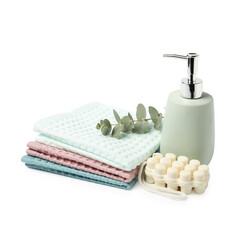 Clean waffle towels, soap and eucalyptus isolated on white