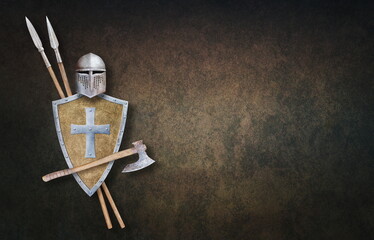 knight's helmet axe shield and two spears on grunge background