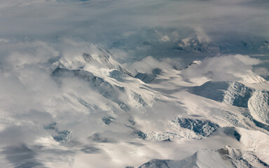 Mountain and clouds view of the Antarctica.