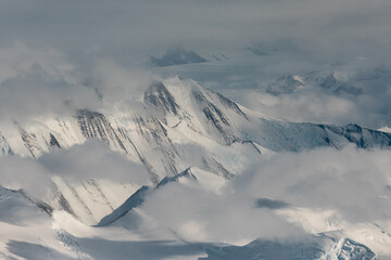 Mountain and clouds view of the Antarctica.