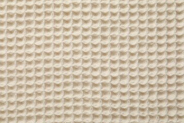 Clean beige waffle towel as background, top view