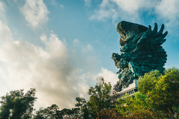 Bali's Most Iconic Landmark Hindu God Garuda Wisnu Kencana statue also GWK statue is a 122-meter tall statue located in Garuda Wisnu Kencana Cultural Park, Bali, Indonesia.