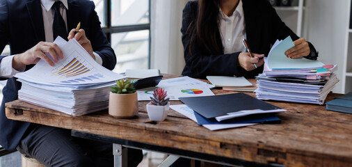 Accounting record with analyze financial data calculator in meeting office, Accounting company charts and graphs banner, double exposure successful business finance and taxation planning concept.