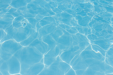 The light reflects blue in the water in the swimming pool. It looks fresh and lively, suitable for use as a wallpaper.