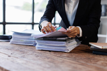 Business Documents, Auditor business checking searching document paperwork or report for analysis...