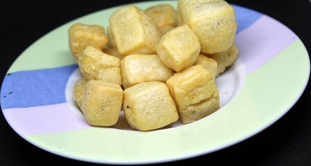 Square crackers on a plate.