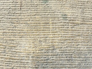 Outdoor horizontally scraped wall.