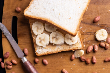 Delicious toast topped with peanut butter, banana slices,Crunchy bread slice with creamy peanut...