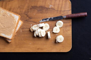 Delicious toast topped with peanut butter, banana slices,Crunchy bread slice with creamy peanut...