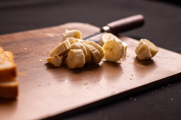 Photo of, A slice of artisanal sourdough bread with a thick spread of creamy peanut butter, Minimalist kitchen counter setting